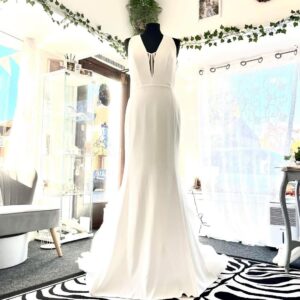 This fit and flare gown by Vera Wang wedding dress is a striking fusion of modern minimalism and dramatic flair: